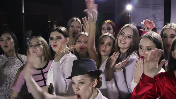 Joyful Beautiful Girls Smile. Happy Young Adult Women Models. Wave Hand Gesture. alt