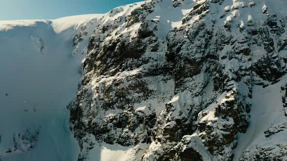 Flying Close To Snowy Rocky Peak By Psystein Videohive