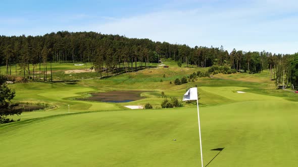 Hills Golf Club in Molndal near Gothenburg on windy and sunny day, Sweden. Aerial sideways alt