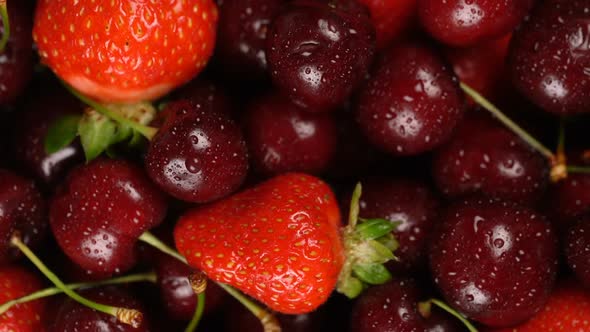 Fresh, Ripe, Juicy Cherries and Strawberries Background, Close Up Berry, Rotation Zoom Out.