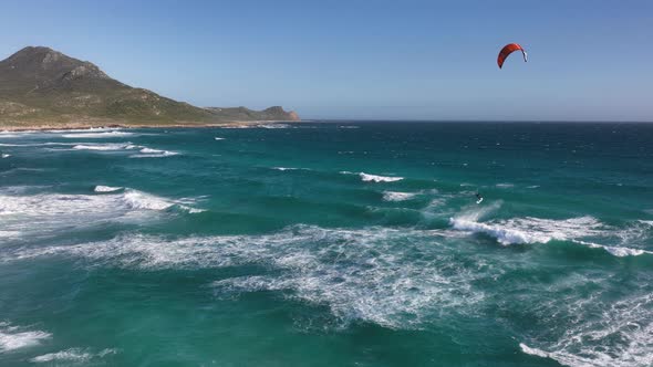 Slow Motion Aerial Drone Shot of Kitesurfer Getting Massive Air at The Cape of Good Hope in Cape Poi alt