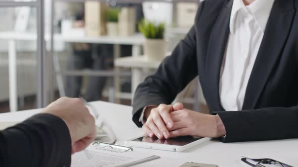 Businessman Making Deal with Female Partner alt