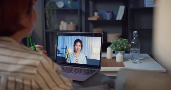 Asia drink beer having fun happy moment night party event online celebration via video call. alt