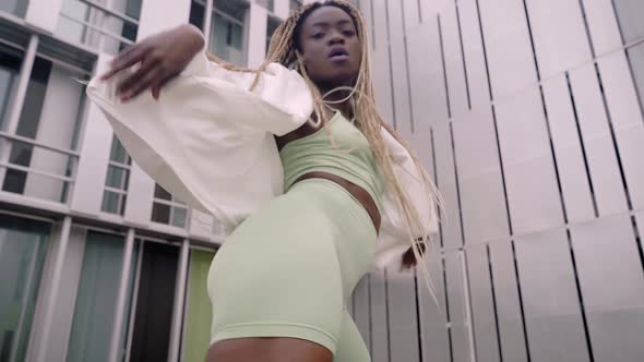 Dancing Woman Attractive Hispanic Street Dancer in City Performing Contemporary Hip Hop Moves alt