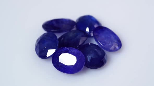Natural Dark Blue Sapphires Gemstone on the Background