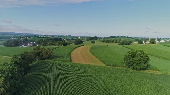 Aerial View On Pennsylvania Countryside With a Single Rail Road Track and a Small Bridge alt