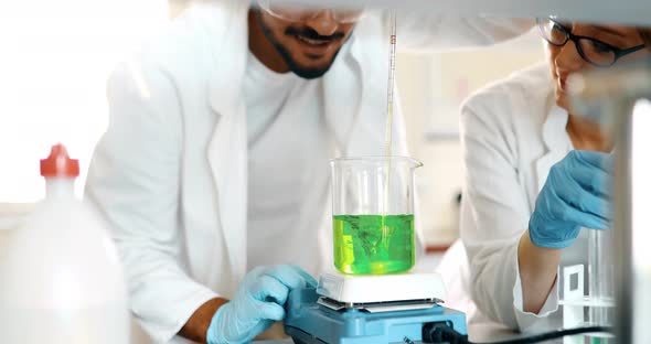 Attractive Student of Chemistry Working in Lab