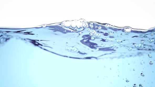 Super Slow Motion Shot of Clear Waving Water With Bubbles Background at 1000 Fps alt