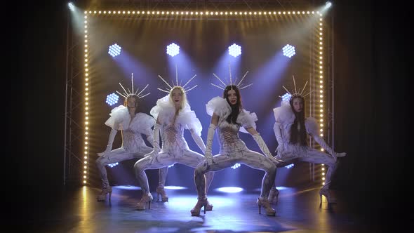 A Modern Choreographic Dance Performed By a Group of Slender Young Women in Tight-fitting Flounced alt