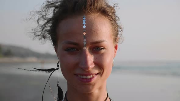 Portrait of Young Woman with Indian Bindi Looking To Camera  alt