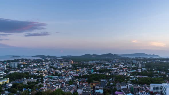 Phuket city aerial scenic view from Khao Rang Hill Park, during sunset; day to night  - Time Lapse