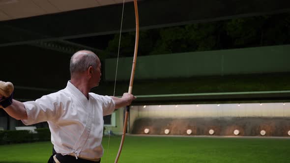Kyudo Practicing Bow Shooting at Night in Kyoto Japan alt