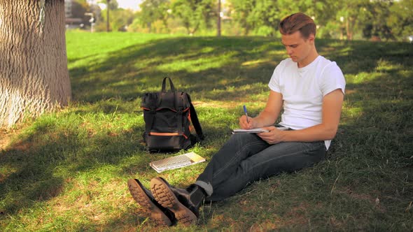 Guy Studying in Park alt