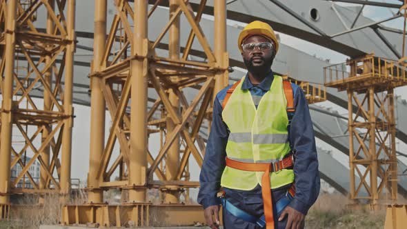 Worker Posing at Construction Site alt