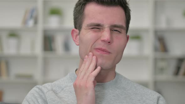 Portrait of Sick Young Male Designer Having Toothache alt