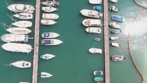 Bird's-eye view of pier on Mgarr Harbour, overlooking the moored boats, Gozo Island in Malta alt