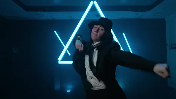 Young Woman Dancing Hip Hop in Smoky Studio alt