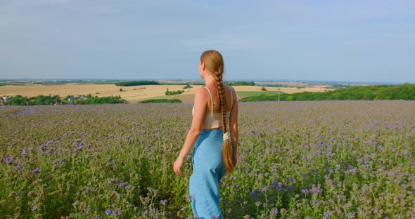 Free Woman Walks in a Field alt