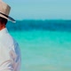 Businessman Relaxation Travel On Beach Vacations. White Sand And Calm Ocean On Seychelles. - VideoHive Item for Sale