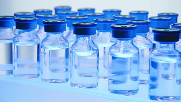 Group of Vaccine bottles. Medicine in ampoules. Glass vials for liquid samples in laboratory. alt