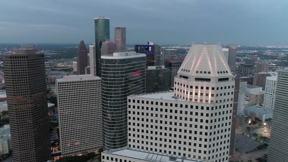 This video is about an aerial view of the downtown Houston skyline in the evening. This video was fi alt
