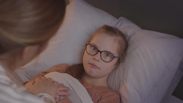 Caring Mother Measuring Temperature of Little Daughter alt