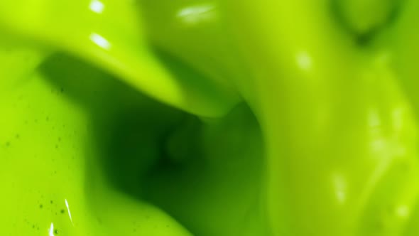 Super Slow Motion Shot of Swirling Green Color Background at 1000Fps alt