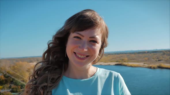 Portrait of European Happy Woman or Cheerful Girl Looking in The Camera, Blowing Wind Hair the Wind. alt