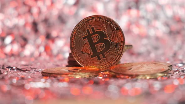 Bitcoin on a Bright Shiny Background Illuminated in Red As a Symbol of the Fall of the Rate