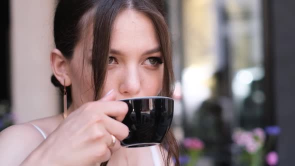 Close Up Portrait of a Beautiful Bride Drinking a Cup of Coffee alt