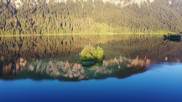 Flight over lake Eibsee with Maximilian island, Bavaria alt