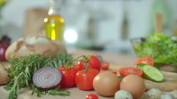 Close Up Cutting Table with Fresh Green Ingridients at the Kitchen alt