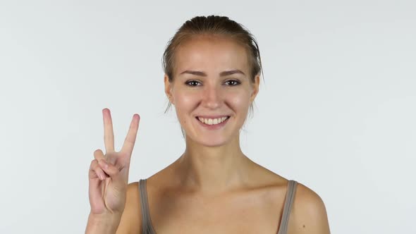 Sign of Winner, Portrait of Victorious Beautiful Girl, White Background alt