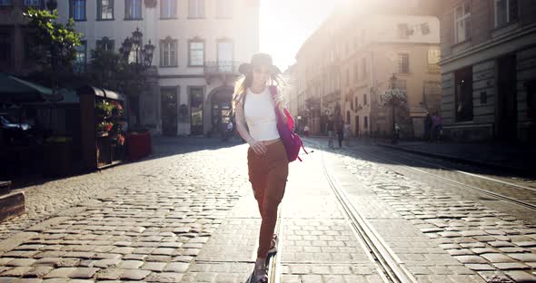 Happy Girl Walking on Summer City