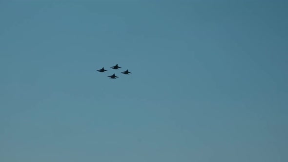 A Group of Fighters Flying in the Sky.