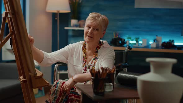 Wheelchair User with Artistic Skills Creating Vase Sketch alt