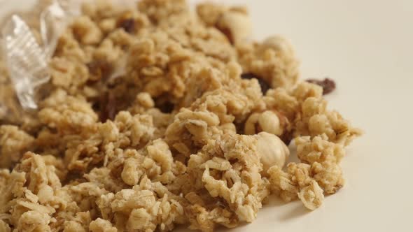 Slow pan on high quality cereals heap 4K 2160p 30fps UltraHD footage - Muesli with  hazelnuts flavor alt