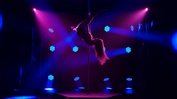 Sexy Brunette in Swimsuit with Rhinestones and High Heels Rotates on a Pole alt