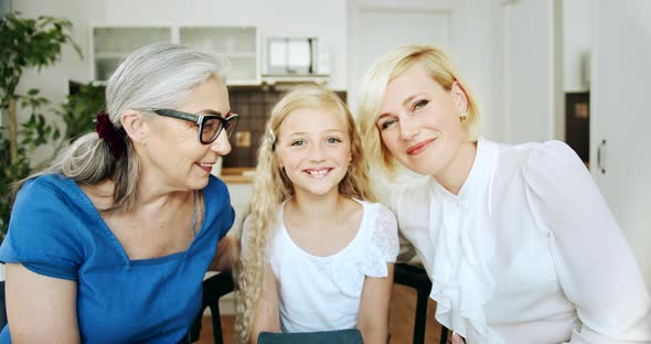 Grandmother and Daughters Portrait Indoors