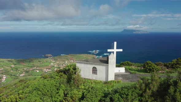 Aerial View of Charming White Church on the Hill of the Remote Archipelago alt