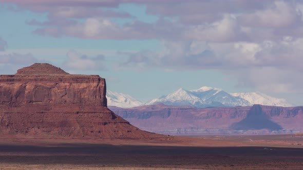 Monument Valley, Utah and Snowy Mountain Cloudscape alt