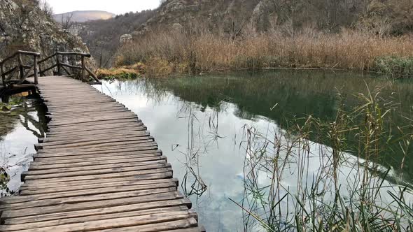 Wooden Bridge Over The Water In Nature Park Plitvicka Jezera In Croatia