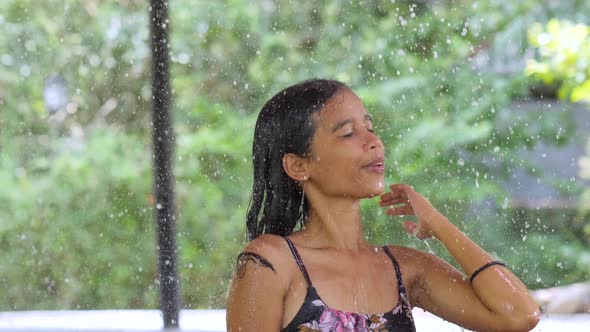 Close Up Portrait of Happy Beautiful Young Woman Taking Shower Outdoor alt