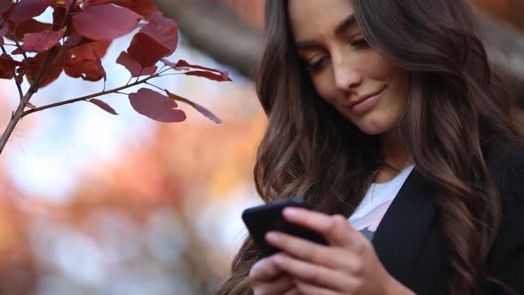 Young Girl Holding a Smartphone