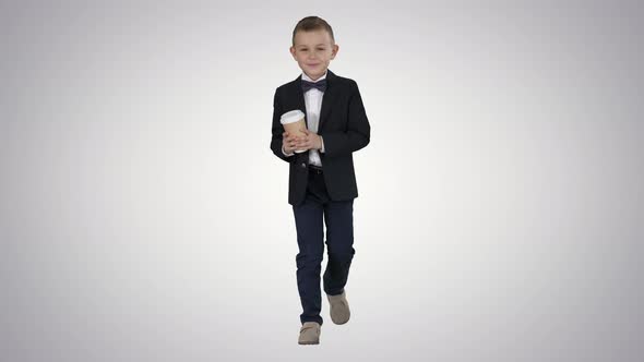 Boy Walking with a Take Away Coffee in a Formal Clothes on Gradient Background. alt