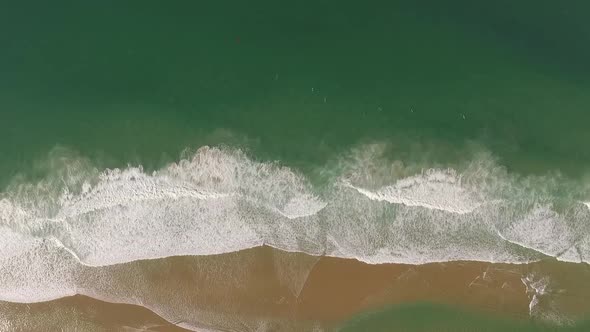 Ocean Waves and Tiny Surfers