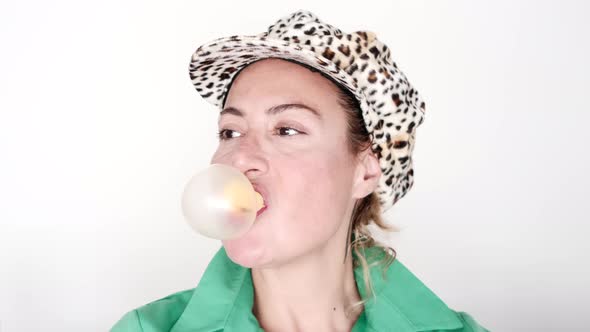 Woman Chewing Bubble Gum And Making Balloon