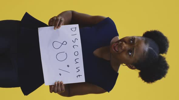 Woman Holding Discount Sign alt