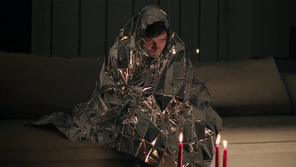 Man is wrapped in a shiny material