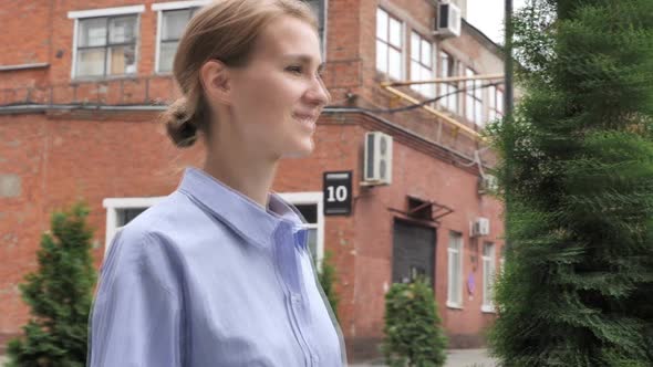 Woman Walking on Street alt